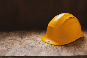 construction-helmet-at-wooden-table-background-tex-2022-09-16-01-57-20-utc